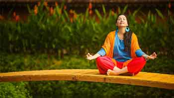 lady medidating amidst nature at resort, wellness tourism goa