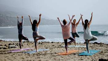 yoga class at a beach in goa, wellness therapy goa